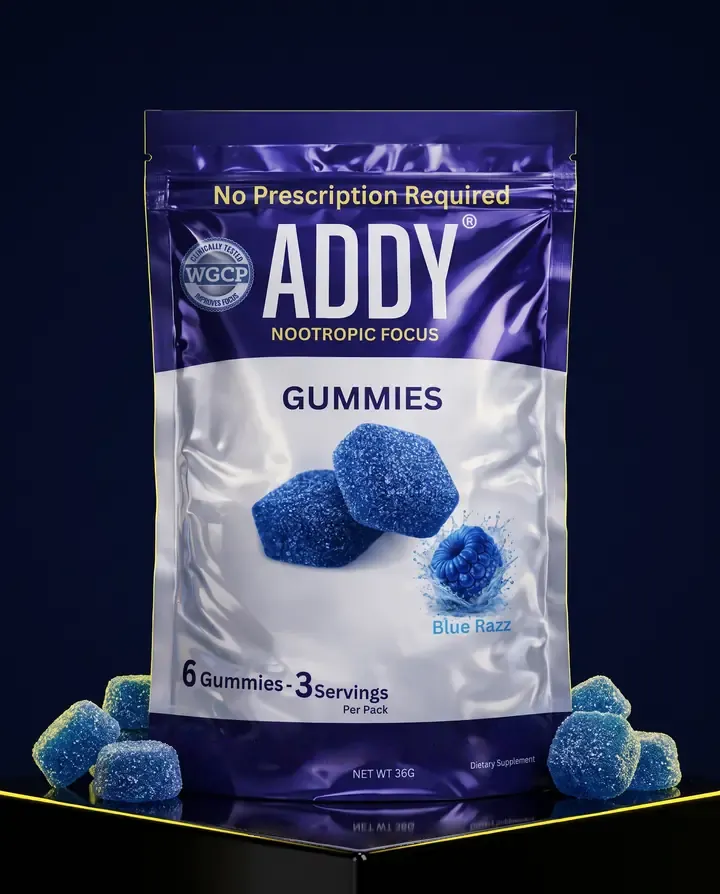 A Blue Razz pouch of ADDY gummies on a black plinth, blue gummies scattered around it.