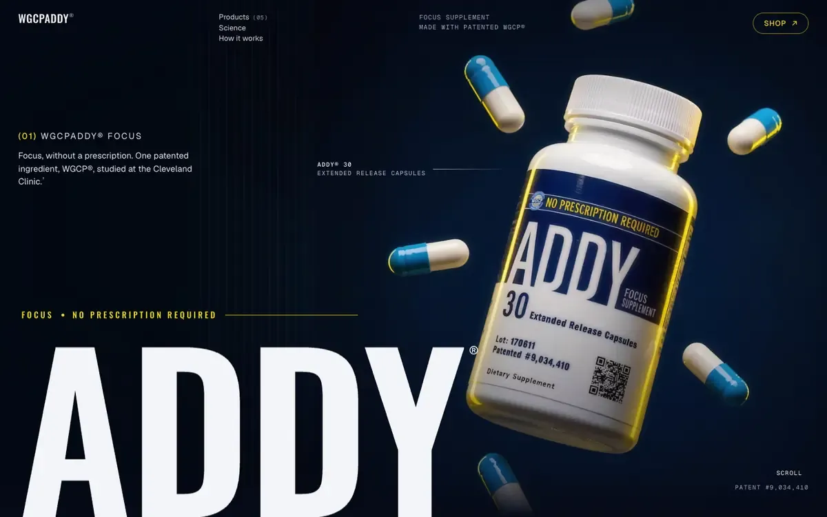 The WGCPADDY concept site: the white-cap ADDY bottle in mid-air on dark navy among blue and white capsules, a yellow rim light along it, and a giant ADDY wordmark.